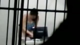 sexy brunette masterbates in a cell behind bars while on her laptop porn