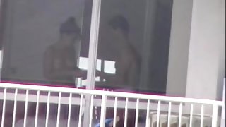 topless girl applying sunscreen voyeur thru windown in PR