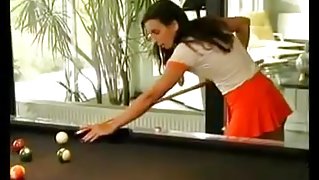 Two ladies in the billiard room.