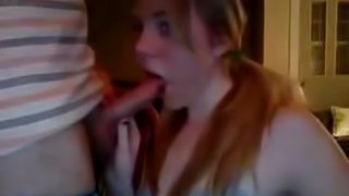 cute redhead in pigtails proudly gives her boyfriend a blowjob