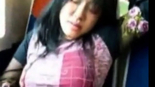 Asian girl fingers herself on public train