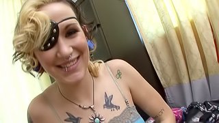 Her leather eye patch and tattoos are sexy as you fuck her hole