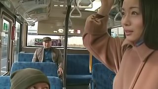 Japanese slut lets a man finger her pussy in a bus