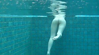Skinny dipping Japanese girl has a shaved pussy