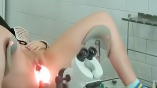 Amateur doctor shows off her shaved pussy on the hidden cam