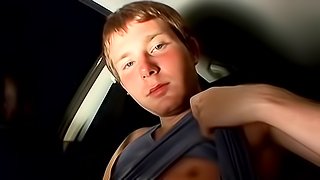 Gay brunette is wanking in the car