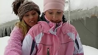 Lesbian chicks warming up by having sex outdoors in the snow