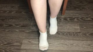STUDENT GIRL SHOWS WHITE SOCKS AND FEET AFTER STUDYING.