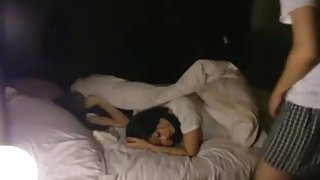 Having sex with his asian gf, while her friend is napping next to her.