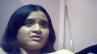 Slutty Indian teen flashes her natural tits in webcam solo