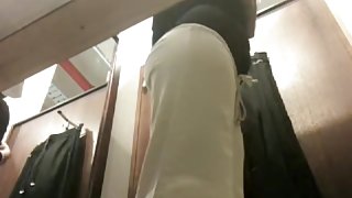 Babe in changing room trying on cloths and getting ass spied