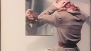 A retro BDSM video with a blonde girl getting humiliated