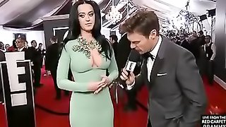 Dark haired woman in green dress gets to have an interview.