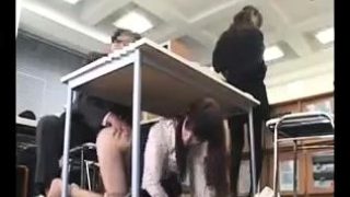 Sensual Asian teen gets under the table and sucks a dick