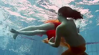 Brunette lesbain teen with natural tits enjoying pool