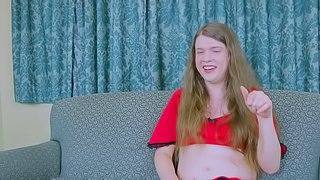 Tranny with long hair relaxes and strokes her big dick