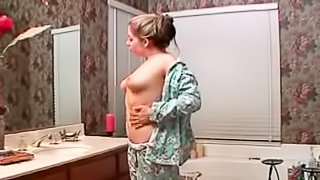 Busty Haley Scott takes a bath and plays with her pussy