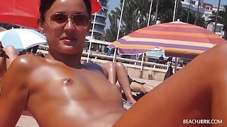 Small tits girl with a great tan is topless at the beach
