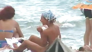 Buxom nude beach babes flaunt their jugs before a hidden camera