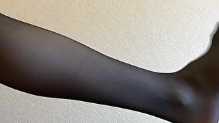 Girl in black nylon pantyhose gets an orgasm