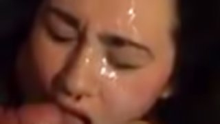 Luscious brunette vixen gets her pretty face splattered with cum