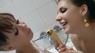 Lesbians have fun in the bathroom with the help of banana