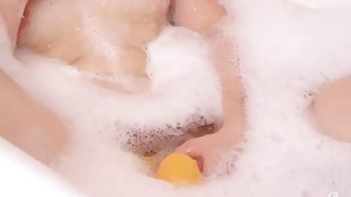 Sexy Babe Masturbates Her Pussy With A Rubber Duckie While In Bubble Bath