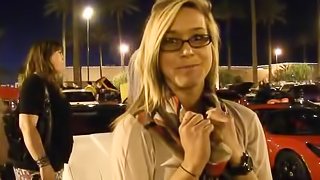 Slutty blonde Kennedy demonstrates her natural tits in the street