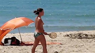 Topless cute girl on the beach is filmed on my voyeur tape