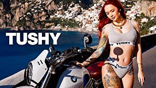 Redhead model Purple Bitch anally impaled in the cowgirl pose