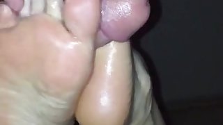 Footjob. Blowing cum all over my bitches sexy feet.