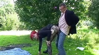 This grunge chic is outdoors having a picnic with her man