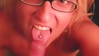 Amateur blonde girl with glasses sucking cock in a home video