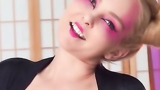 Blonde with oriental makeup fucks with black toy