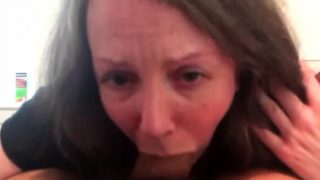 Hot brunette milf with big boobs gives a blowjob
