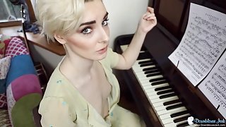 Piano playing British girl has her small tits exposed