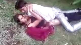 Indian couple fools around in the grass
