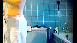 Slender brunette with small tits on the shower hidden cam