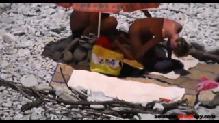 Doggystyle sex on voyeur beach exposed by hidden camera