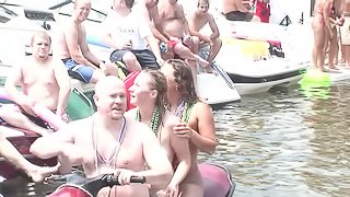 Doting pornstar gets her tits licked at an out of control bikini party