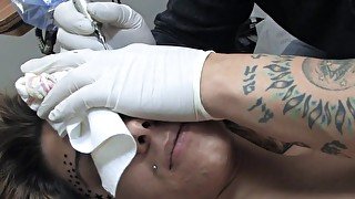 Amina Sky gets a face tattoo while completely nude