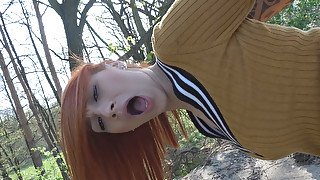 Smoking hot redhead rides big fat dong in the woods