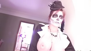 Chick with a scary voodoo mask showing her impressive juggs with pleasure