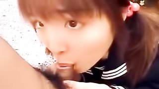 Petite pigtailed Japanese teeny in school uniform trying to fit a huge boner into her tiny mouth