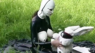 Rubber Girl Full in Black Latex Catsuit and Mask Plays with herself Outdoor in a Meadow - Part 3