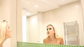 Blazing blonde solo model with small tits taking a bath