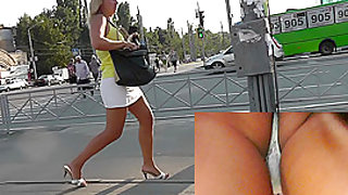 Upskirt panties of the tanned blonde mature lady