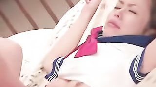 Japanese teen lays down on a white floral bed and displays her small tits wearing her blue and white school girl costume while she lets her boyfriend screw her in missionary position.