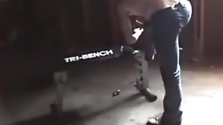 Couple has sex on a workout bench in a filthy garage