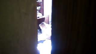 My spy cam peeks at the topless girl ironing her clothes